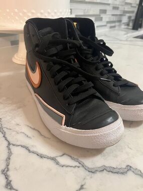 Nike Blazers Women’s Black High-Top Sneakers with Orange and White Swoosh